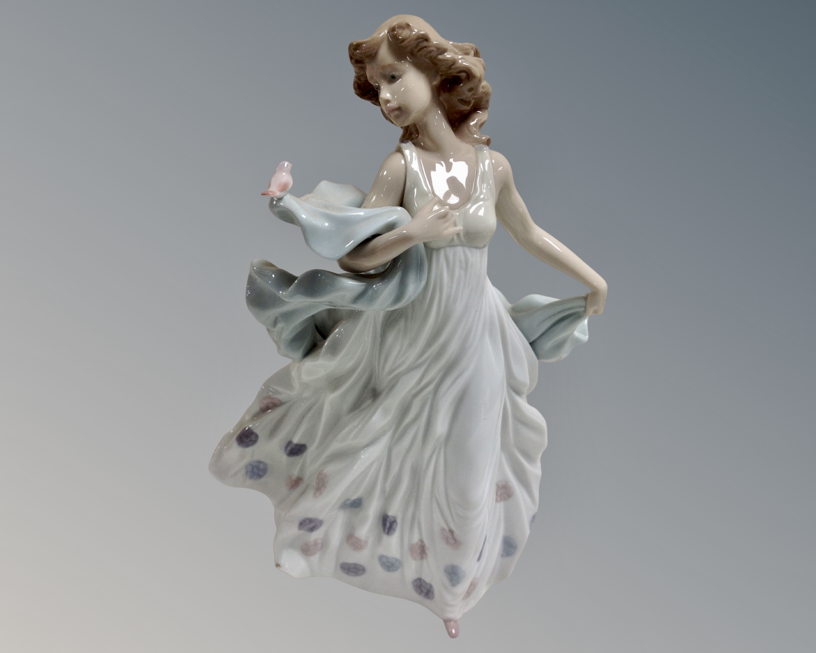 A Lladro china figure : Summer Serenade, model number 6193.