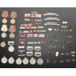 A quantity of military insignia including group of Pakistan Independence Medals,