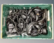 A box containing radio handsets and earphones, walkie-talkies etc.