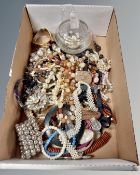 A box of costume jewellery, glass dish, necklaces etc.