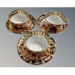Three Royal Crown Derby Imari patterned tea cup and saucers, pattern number 2451,