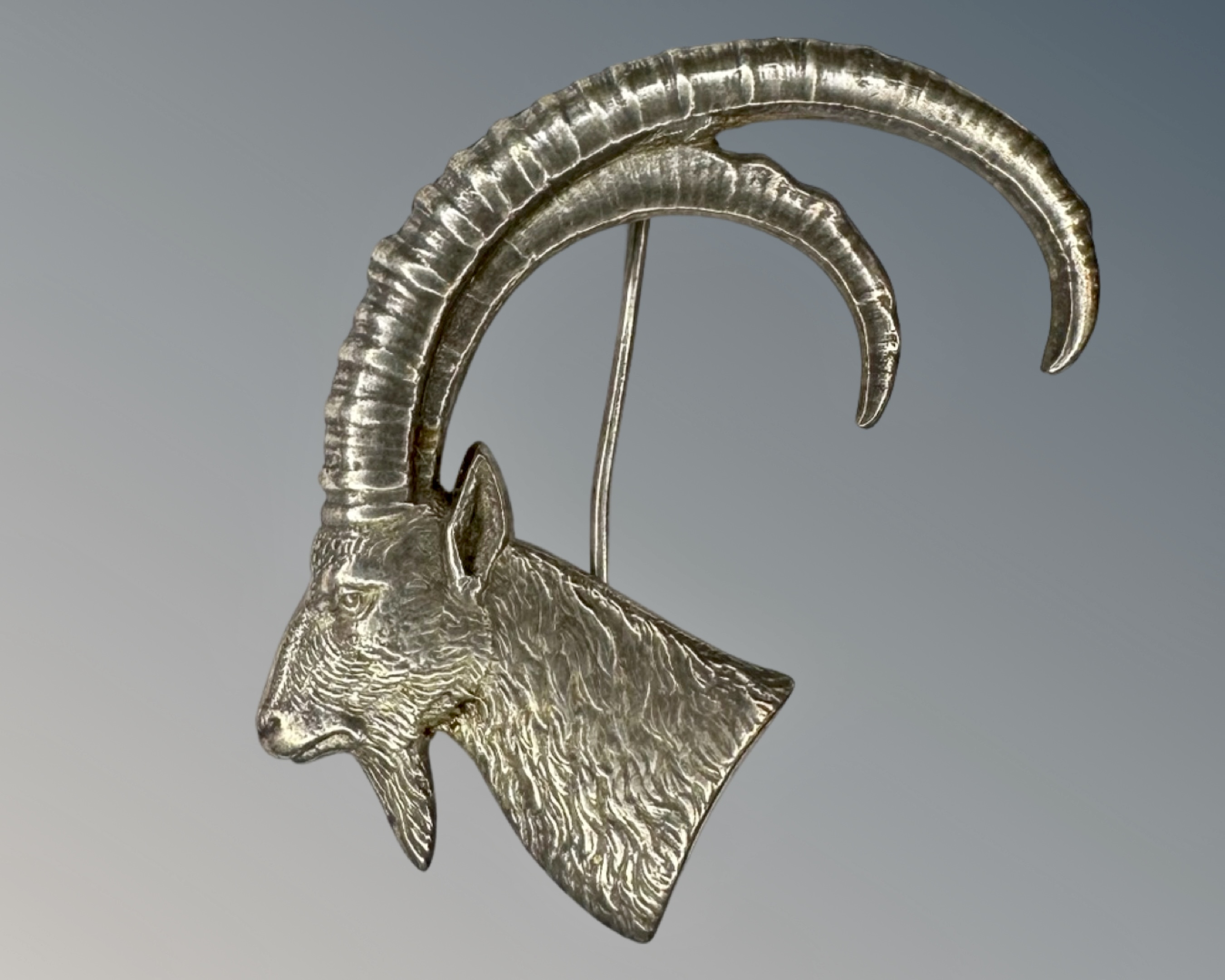 A good quality silver ibex brooch, by Walker & Hall, Birmingham 1920 marks.