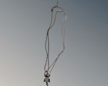 A 19" silver necklace together with an encrusted white metal 18" beaded necklace.