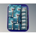 A group of five Gillette Mach III razor blades together with six boxes of replacement blades