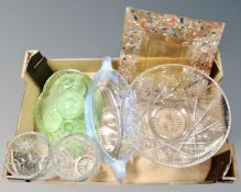 A box containing a green glass dressing table set, a pair of crystal vases,
