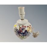 A Moorcroft floral pattern table lamp on white ground,