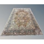 A machine-made carpet of Persian design, 349cm by 252cm.