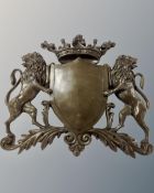 A cast bronze coat of arms.