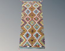 A Chobi Kilim runner, 145cm by 63cm.