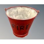 A painted metal fire bucket.