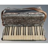 A Hohner Tango IV piano accordion. CONDITION REPORT: Some losses.