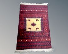 An Afghan Balouch rug, 145cm by 88cm.