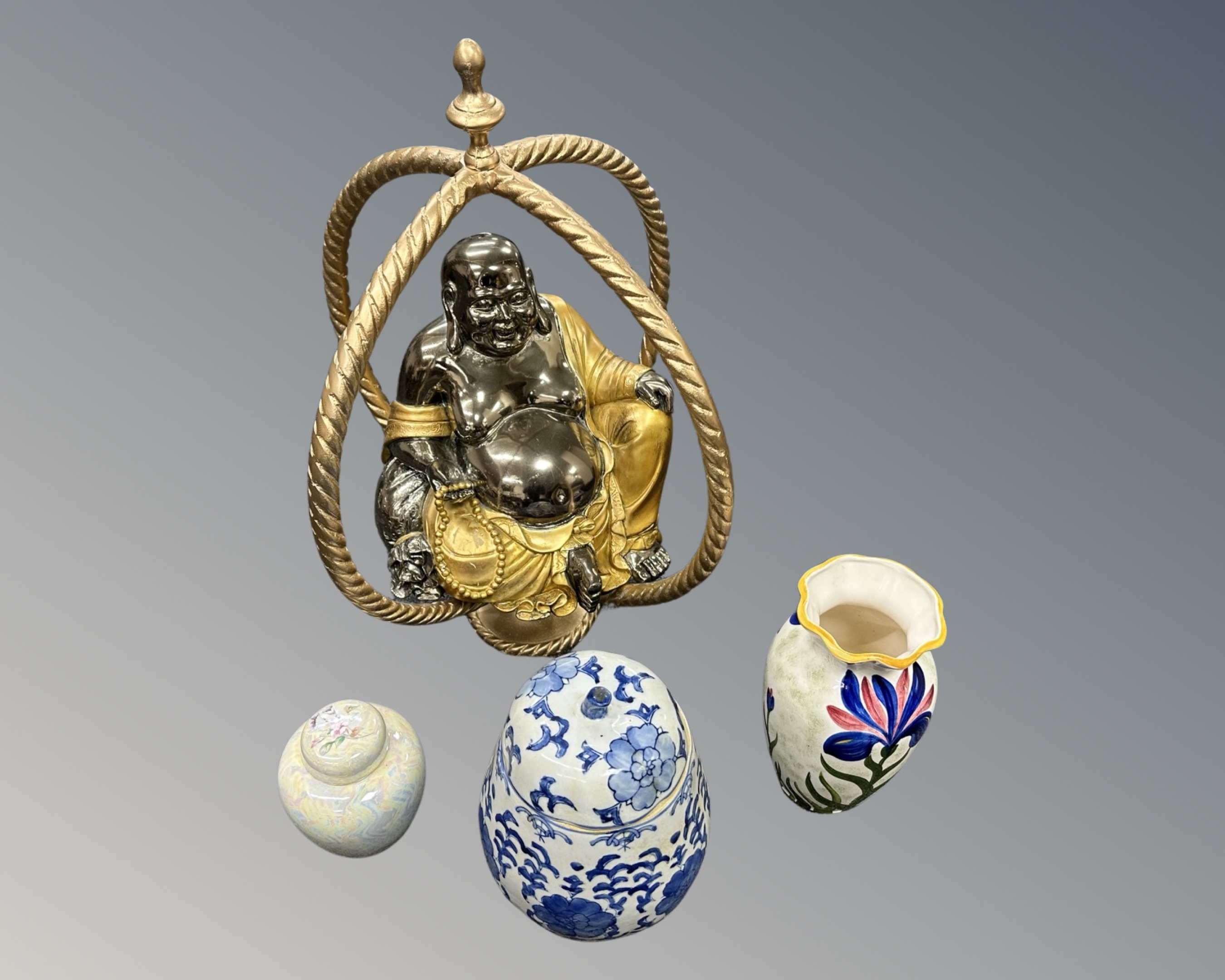 A contemporary silvered and gilt Buddha figure together with three porcelain vases.