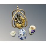 A contemporary silvered and gilt Buddha figure together with three porcelain vases.