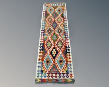 A Chobi Kilim Runner, 206cm by 66cm.