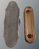 Two brass Arts and Crafts pen trays with inset hardstone cabochons together with a hammered
