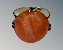 A yellow gold coral ring, size K, shank stamped 18k.