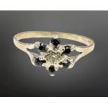 A 9ct gold sapphire and diamond cluster ring, size O.