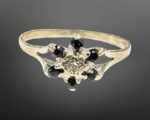 A 9ct gold sapphire and diamond cluster ring, size O.