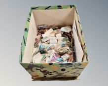 A box containing a quantity of 20th century loose stamps.