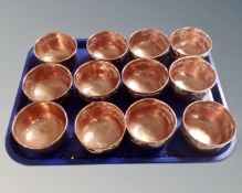 A collection of twelve Victorian embossed copper moulds.