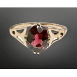 A 9ct gold single stone garnet ring, size I. CONDITION REPORT: 1.