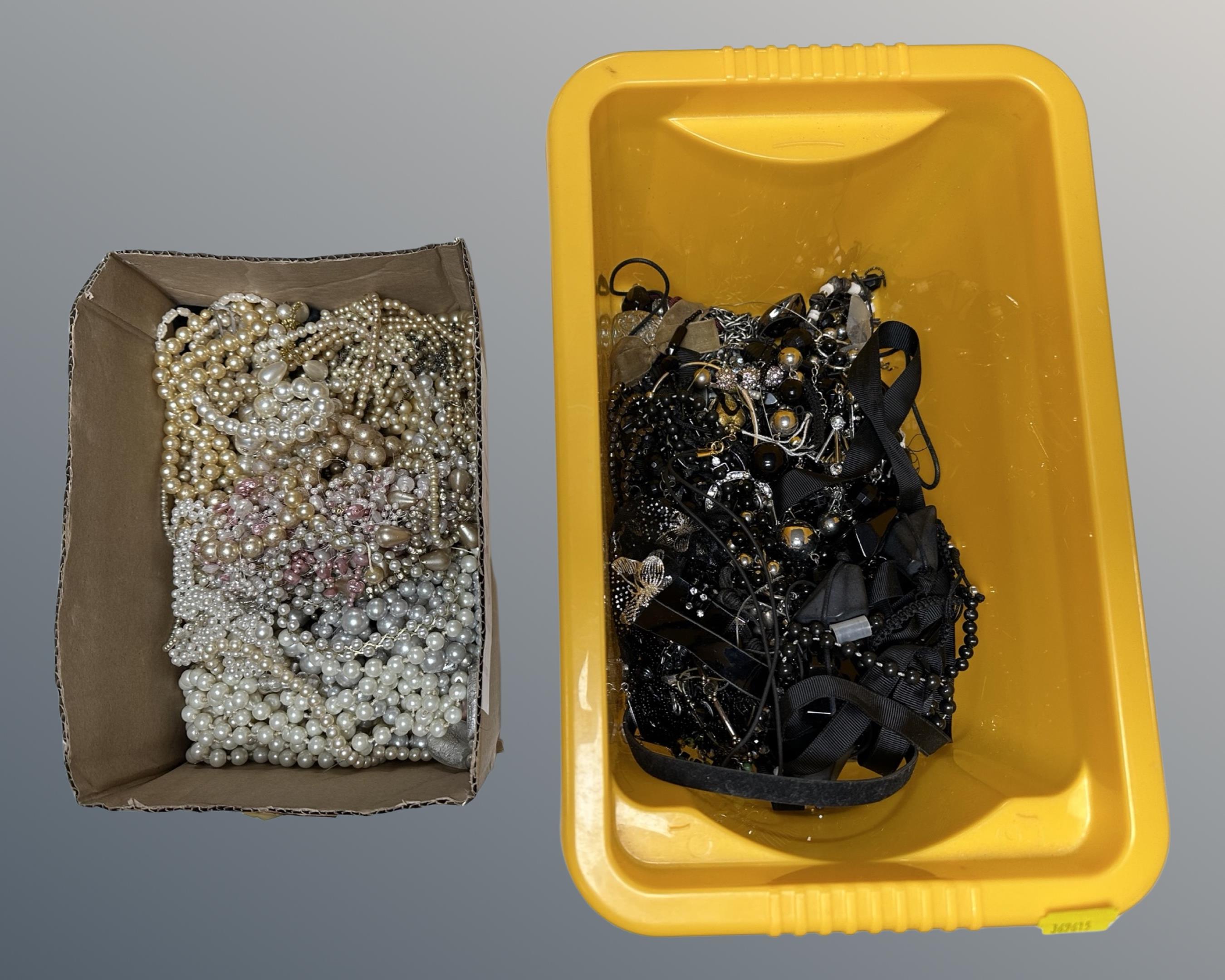 A plastic tub and a box containing costume pearls, black bead costume jewellery etc.