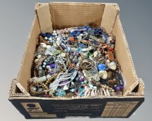 A box of various costume jewellery.