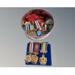 A tin containing approximately RAOB medals.