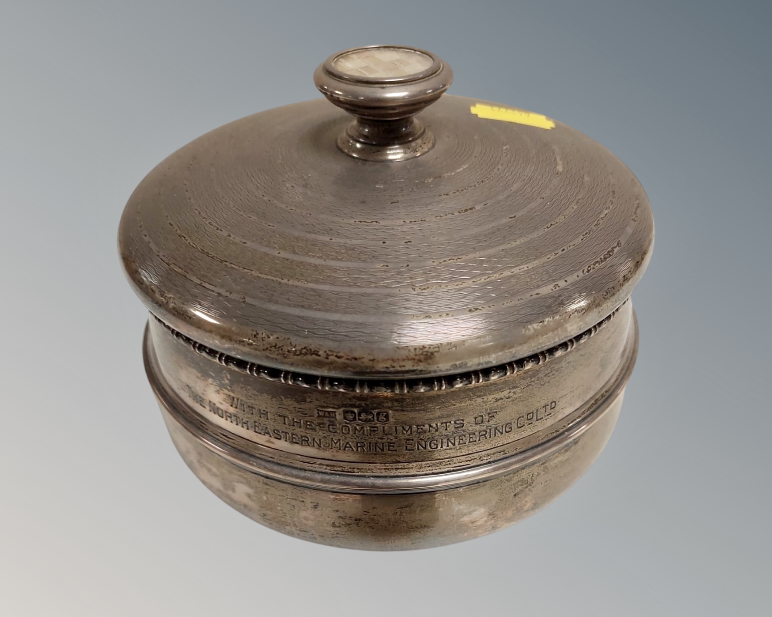 A silver circular lidded bowl with inscription S/S Cedarwood, launched at Burntisland by Mrs. J. W.