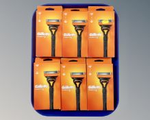 Six Gillette Fusion V razors, boxed.