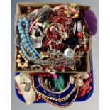 A tray containing costume jewellery including bead necklaces etc.