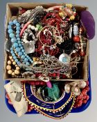 A tray containing costume jewellery including bead necklaces etc.