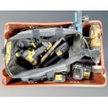 A crate containing assorted power and handtools including DeWalt drill, chargers,