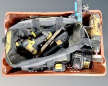 A crate containing assorted power and handtools including DeWalt drill, chargers,