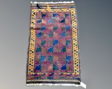 A Balouch rug, Afghanistan, 105cm by 62cm.