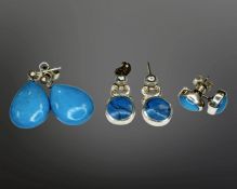 Three pairs of silver and turquoise-coloured stone earrings.