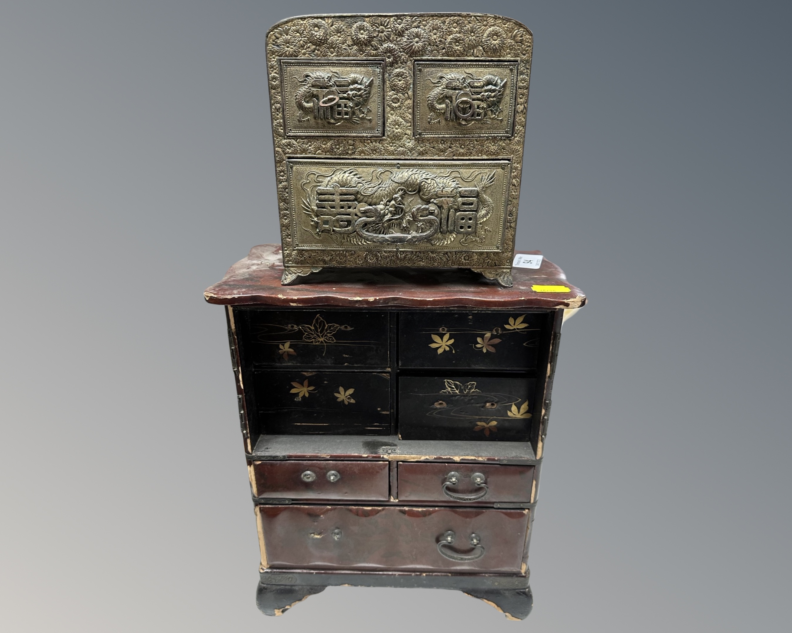 A Japanese Meiji period lacquered table cabinet (AF) together with a Japanese embossed brass