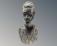 A carved African bust of a man.