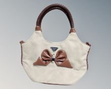 A lady's brown and tan leather hand bag by Prada