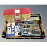 A box of cosmetic gift sets including Nivea Men, Ted Baker, David Beckham, a Yankee candle gift set.
