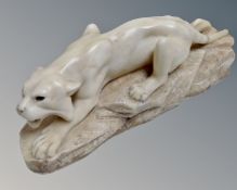 A carved alabaster figure of a panther.