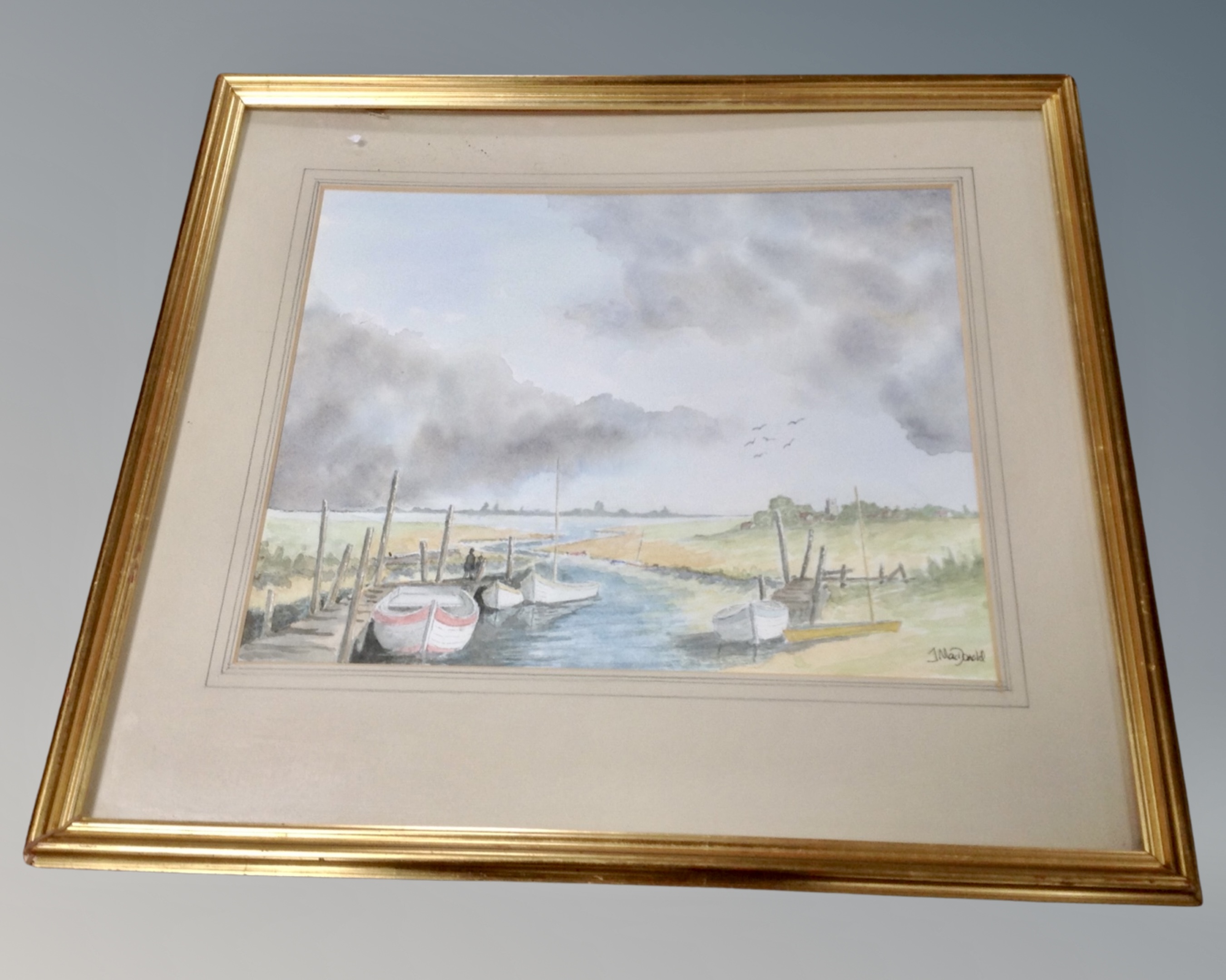 J. Macdonald : Boats in an estuary, watercolour, in gilt frame and mount.