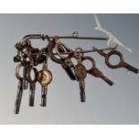 A collection of 10 brass and steel pocketwatch keys.