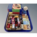 A tray containing two Harry Potter books, a small quantity of vintage playworn die cast cars,