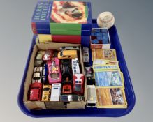 A tray containing two Harry Potter books, a small quantity of vintage playworn die cast cars,