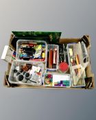 A box containing assorted drawing materials including precision drawing set, writing utensils etc.