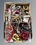 A tray containing a large quantity of costume jewellery including bead necklaces, bangles etc.