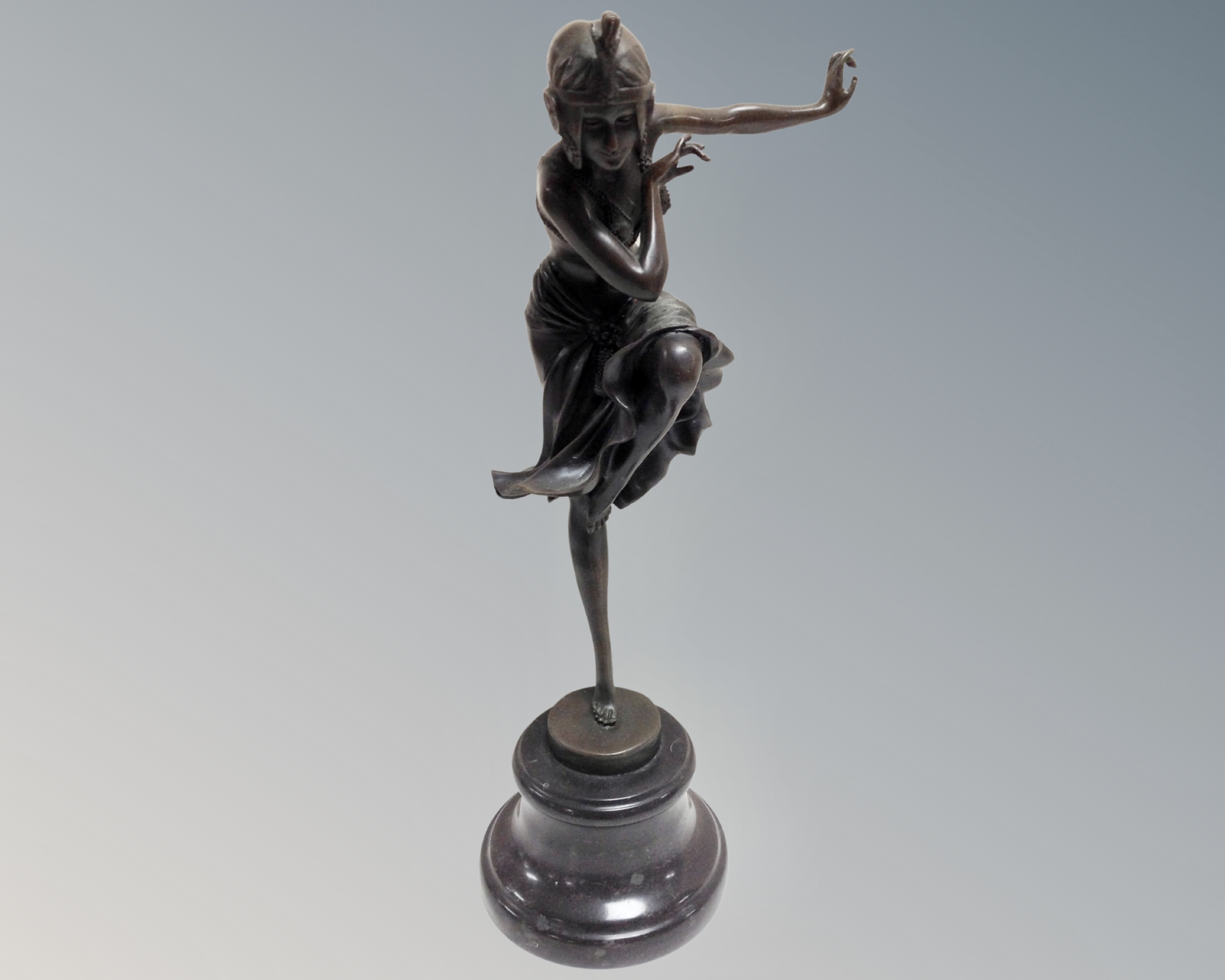 An Art Deco style bronze figure of a dancer, on marble socle.