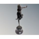 An Art Deco style bronze figure of a dancer, on marble socle.